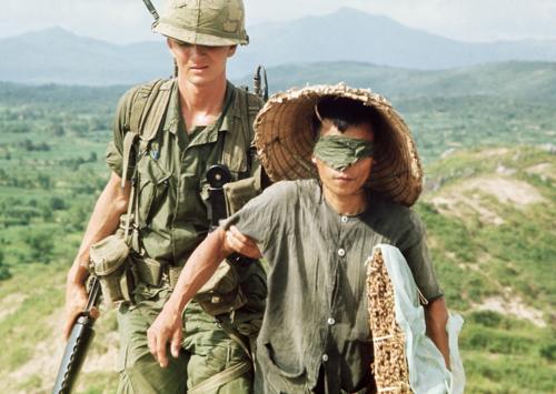 "American soldier with a Vietnamese prisoner" 